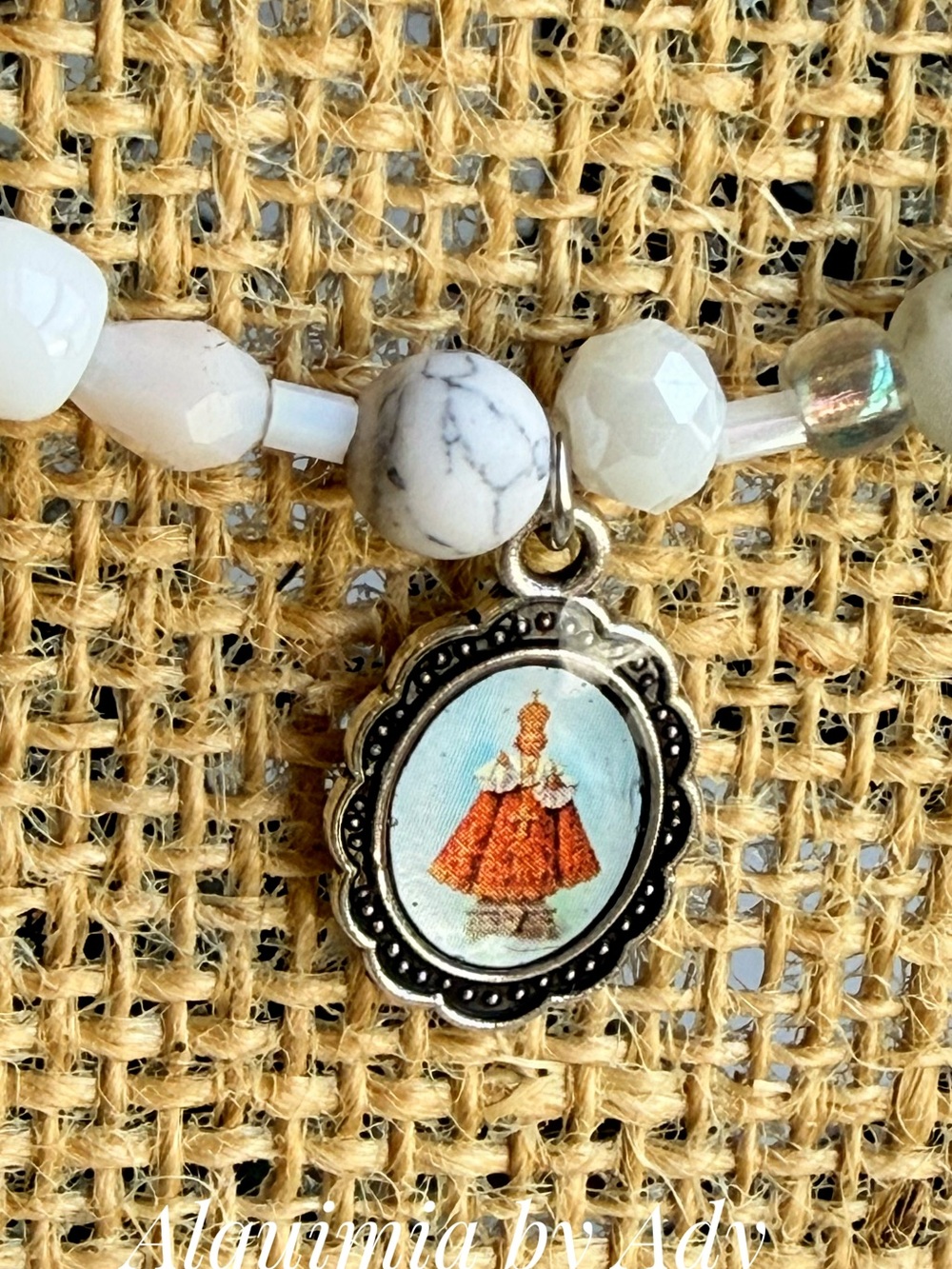 Niño de Atocha + White Beaded Necklace with Saint Pendant and Silver Accents